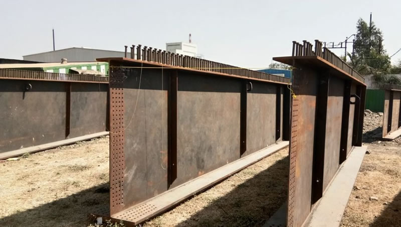 Vigas metalicas armadas con perforacion cnc preparadas para obra en Bogotá, Colombia. Montajes, Ingeniería y Construcción. MIC SAS. Vigas metalicas armadas con perforacion cnc preparadas para obra en Bogotá, Colombia. Montajes, Ingeniería y Construcción. MIC SAS.