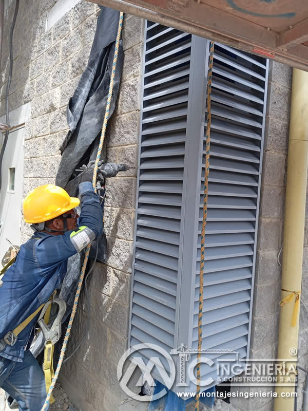 Perforación y anclaje de marcos de lamas en fachadas industriales en Bogotá, Colombia. Montajes, Ingeniería y Construcción MIC SAS.