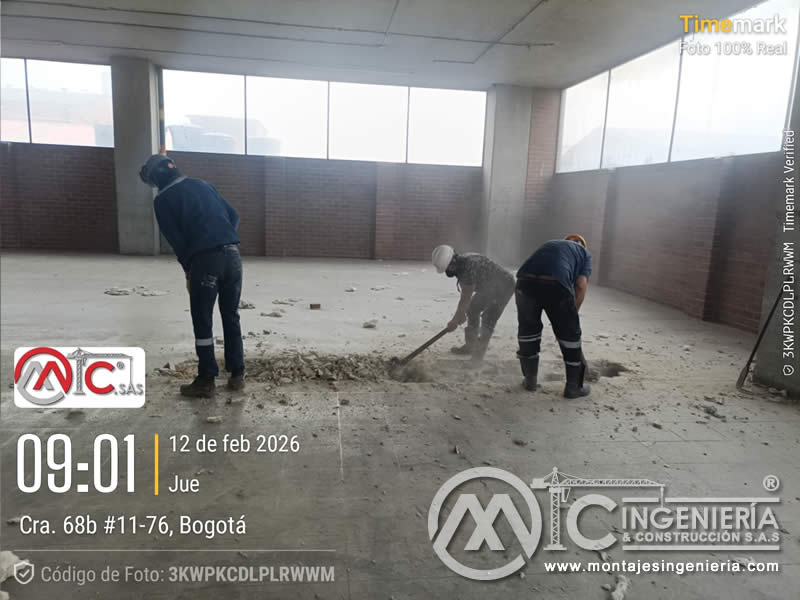 Demolición de placa de concreto para adecuación de local comercial en Bogotá, Colombia. Montajes, Ingeniería y Construcción MIC SAS.