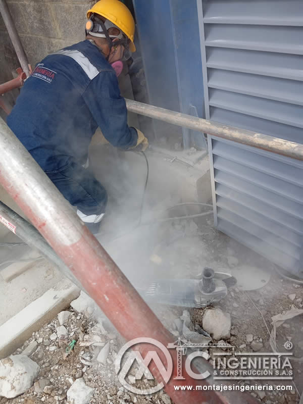Perforación de muros para instalación de rejillas de ventilación industriales en Bogotá, Colombia. Montajes, Ingeniería y Construcción MIC SAS.