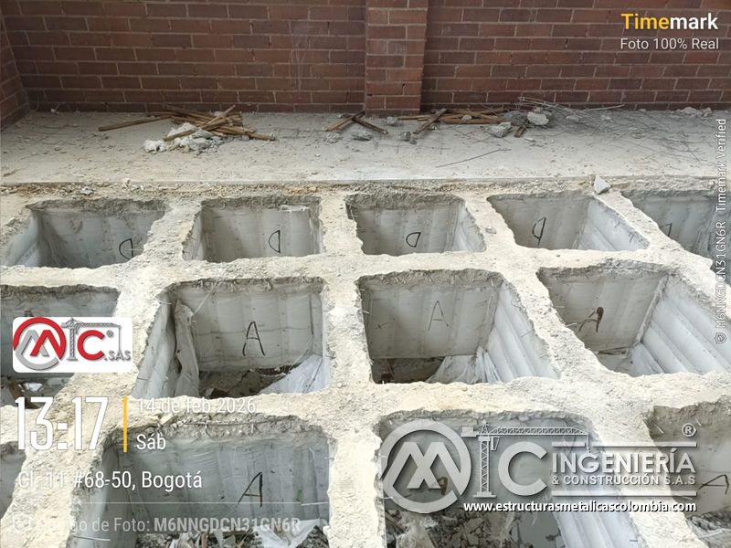 Demolición de losa y huecos para rampas en parqueadero comercial acceso en Bogotá, Colombia. Montajes, Ingeniería y Construcción MIC SAS.