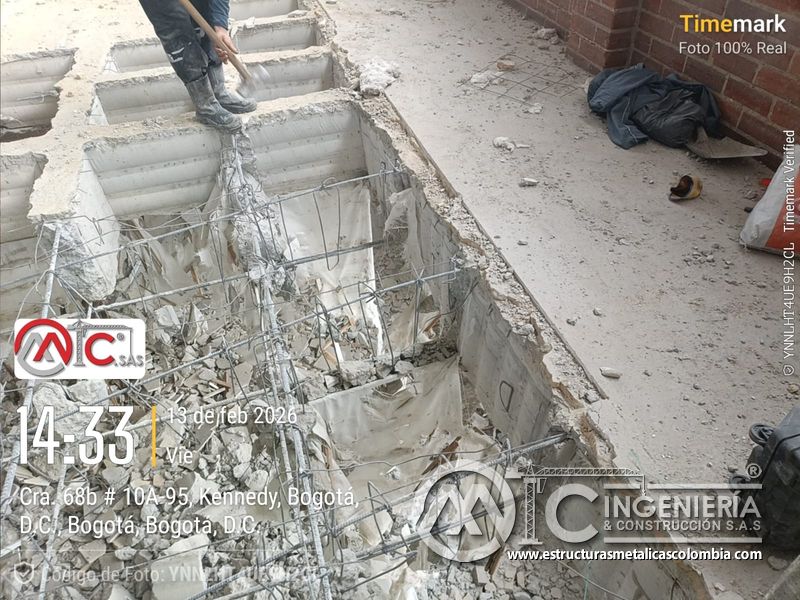 Demolición de losa y huecos para rampas en parqueadero seguridad acceso en Bogotá, Colombia. Montajes, Ingeniería y Construcción MIC SAS.