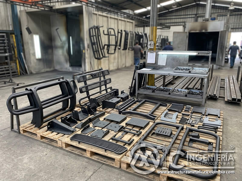 Pintura en polvo para accesorios metalicos de vehiculos comerciales en Bogot?, Colombia. Montajes, Ingenier?a y Construcci?n. MIC SAS.