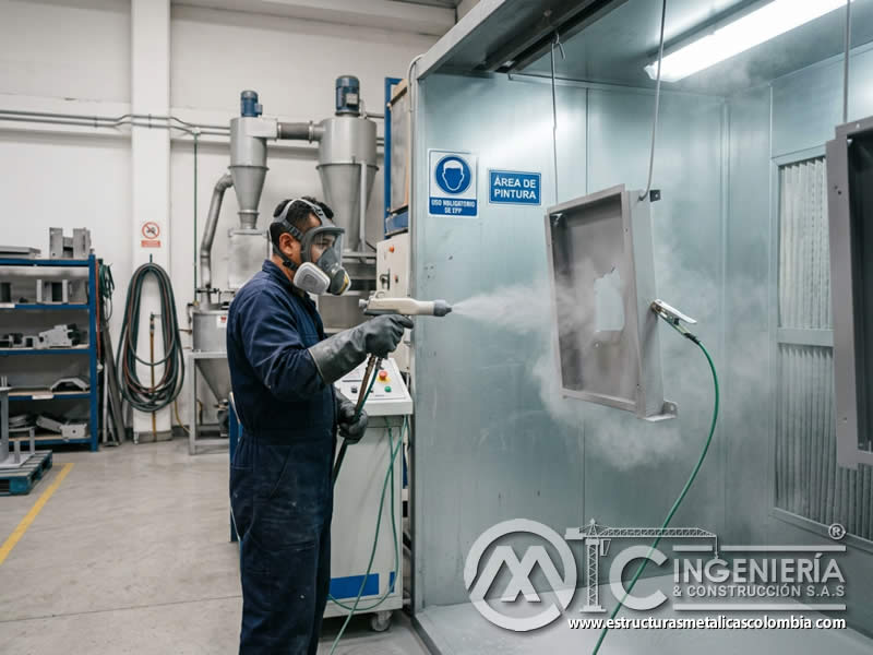Inducción electrostática en pintura en polvo con sandblasting en Bogotá, Colombia. Montajes, Ingeniería y Construcción. MIC SAS.