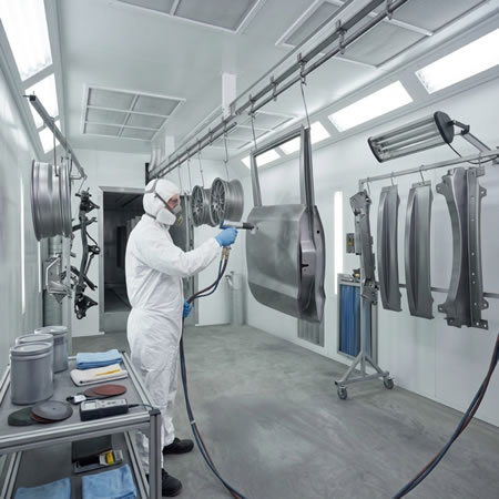 Componente automotriz con recubrimiento uniforme, resistente a impactos, abrasión y productos químicos en Bogotá, Colombia. Montajes, Ingeniería y Construcción. MIC SAS.