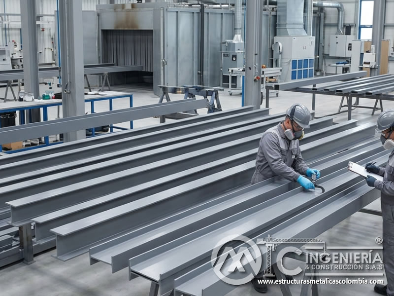 Curado en lote de perfiles metálicos pintados en Bogotá, Colombia. Montajes, Ingeniería y Construcción. MIC SAS.