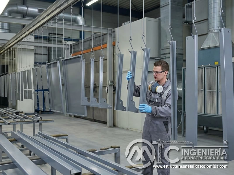 Piezas metálicas en secado separado de pintura industrial en Bogotá, Colombia. Montajes, Ingeniería y Construcción. MIC SAS.